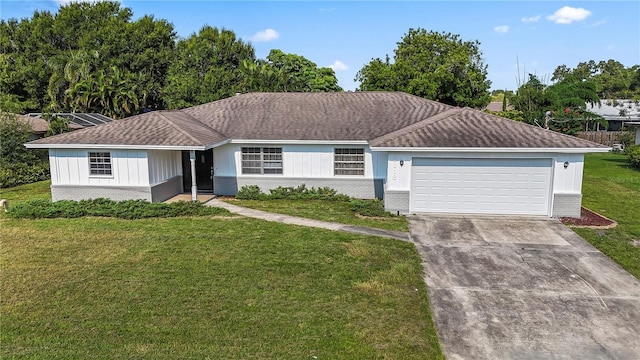 single story home featuring a front yard and a garage