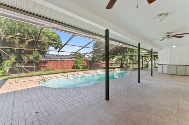 view of swimming pool featuring a lanai, a patio area, and ceiling fan