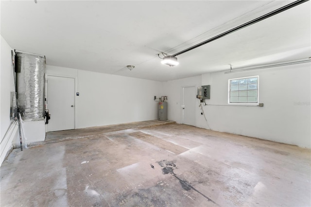 garage with electric panel, a garage door opener, and water heater