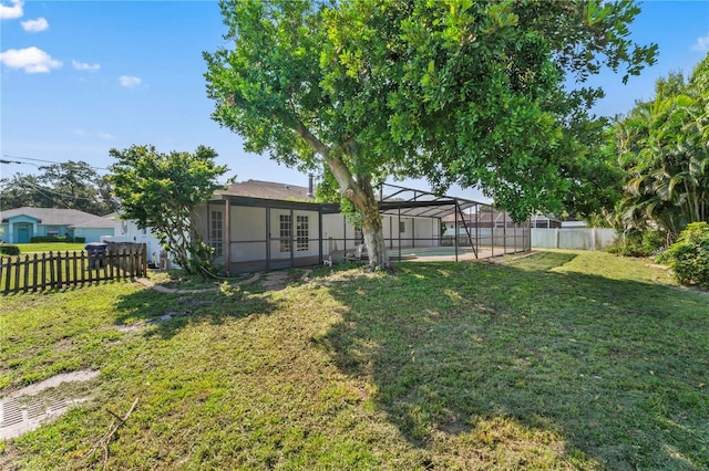 view of yard featuring a lanai and a fenced in pool