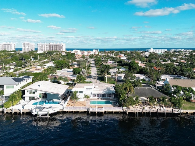 birds eye view of property with a water view