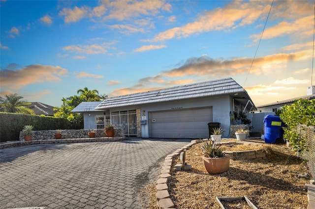 ranch-style house featuring a garage