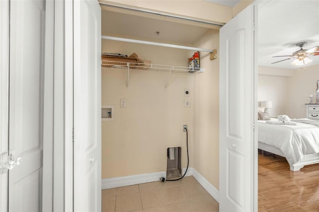 laundry room with ceiling fan, light tile patterned floors, washer hookup, and hookup for an electric dryer