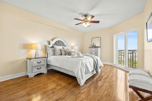 bedroom with light hardwood / wood-style flooring and ceiling fan