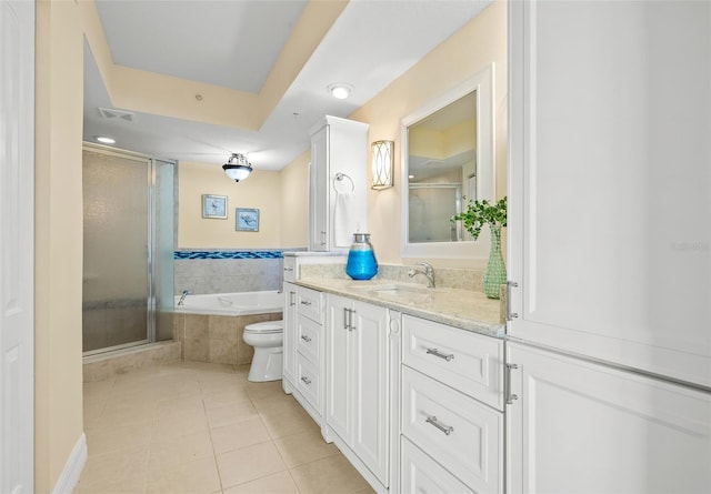 full bathroom with tile patterned floors, vanity, independent shower and bath, and toilet