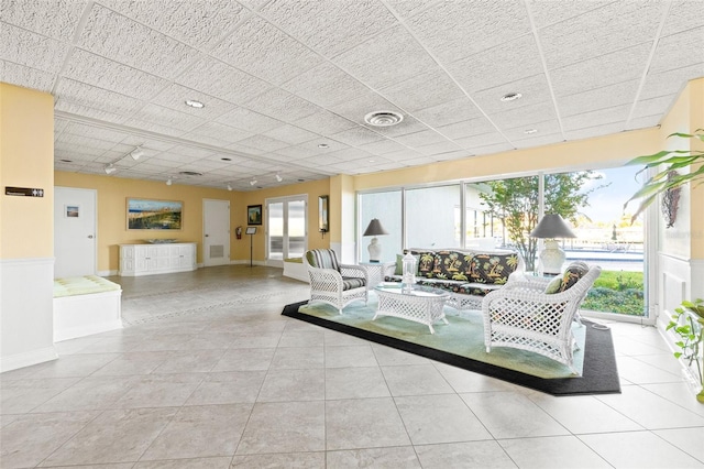 living room with light tile patterned floors and a wealth of natural light