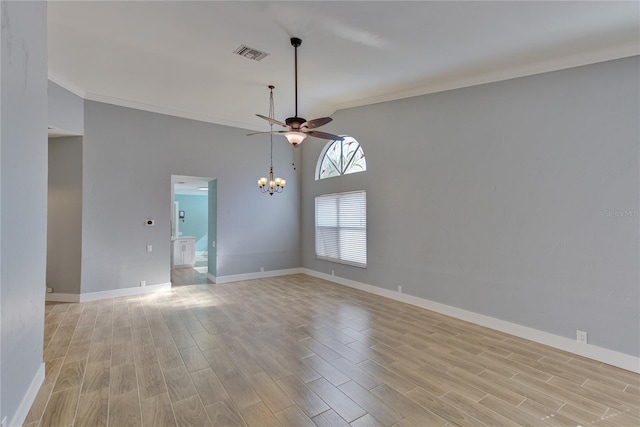 empty room with ceiling fan with notable chandelier, light wood-type flooring, and ornamental molding