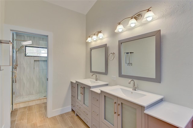 bathroom with wood-type flooring, vanity, and a shower with door