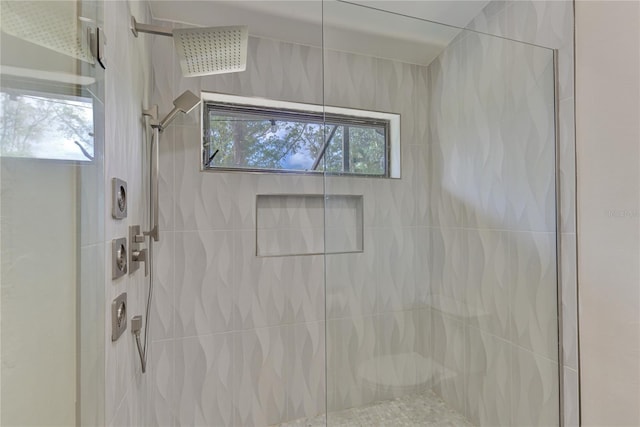 bathroom with a tile shower