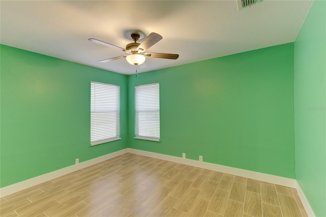 unfurnished room featuring ceiling fan and light wood-type flooring