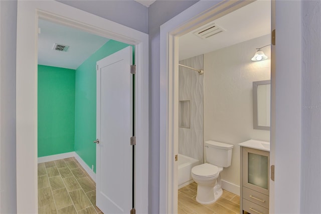 full bathroom featuring shower / bathing tub combination, vanity, toilet, and wood-type flooring