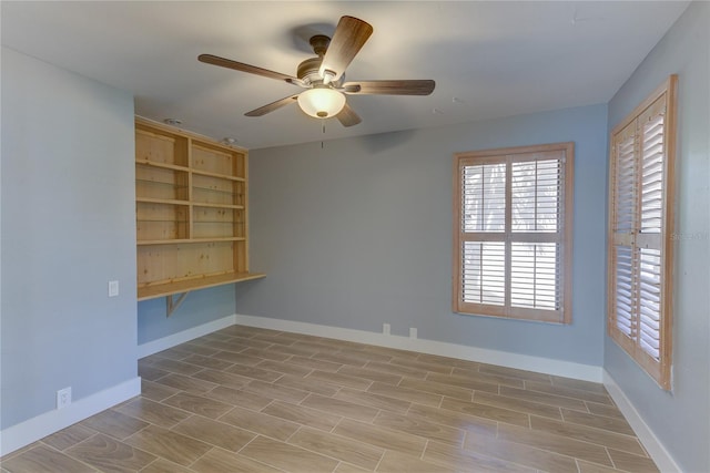 unfurnished room featuring ceiling fan and light hardwood / wood-style flooring