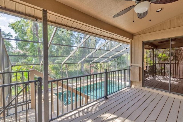 wooden deck with ceiling fan and a patio