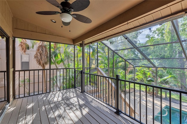 wooden deck featuring ceiling fan