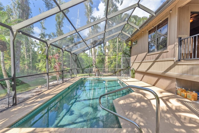 view of pool with a lanai