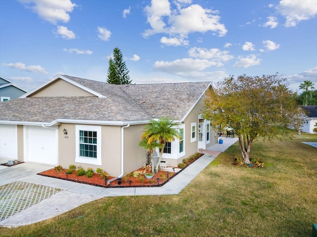 view of front of house featuring a front yard and a garage