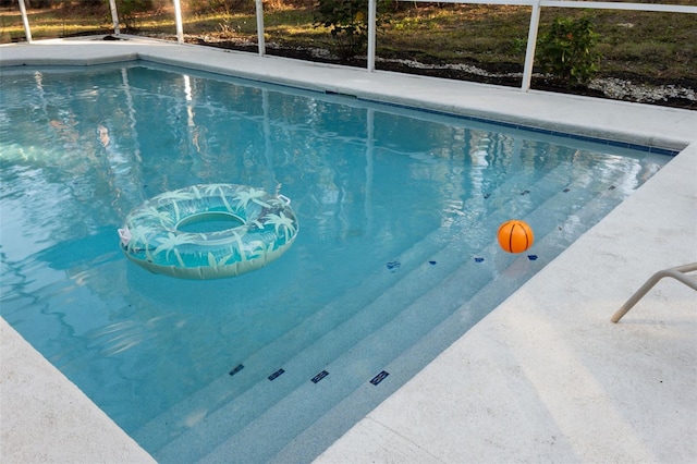 view of pool featuring a lanai