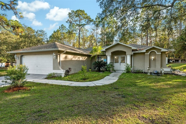 single story home featuring a garage and a front lawn