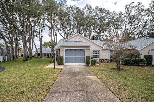 view of front of home with a garage and a front yard