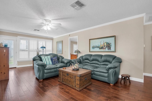 living room featuring ornamental molding, a textured ceiling, ceiling fan, and dark wood-type flooring