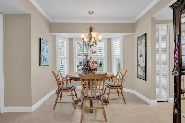 dining area featuring a chandelier, a textured ceiling, and crown molding