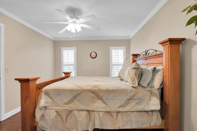 bedroom with ceiling fan, ornamental molding, and multiple windows