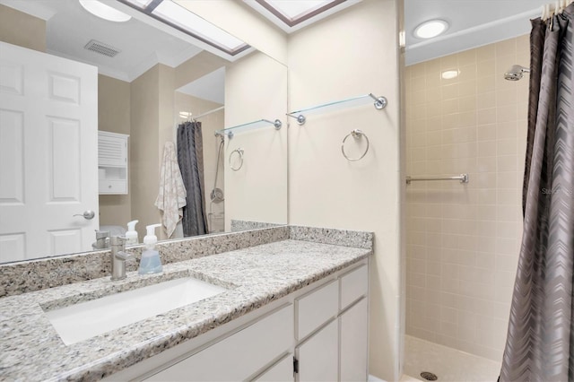 bathroom with vanity and walk in shower