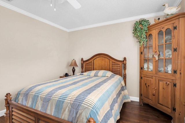 bedroom featuring dark hardwood / wood-style floors, ceiling fan, ornamental molding, and a textured ceiling