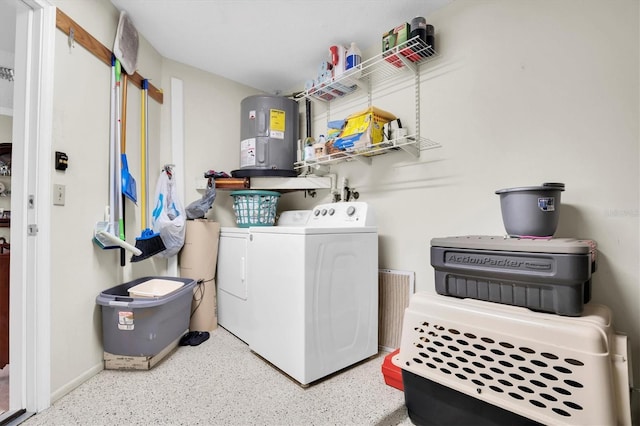 washroom with washer and dryer and water heater