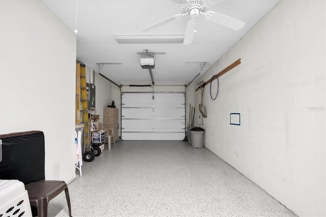 garage with a garage door opener and ceiling fan