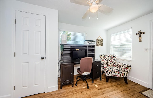 office featuring ceiling fan, baseboards, and wood finished floors