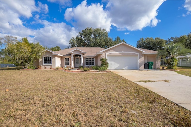 ranch-style house featuring a front yard and a garage