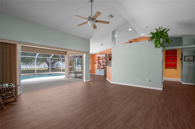 unfurnished living room with ceiling fan, dark wood-type flooring, and high vaulted ceiling