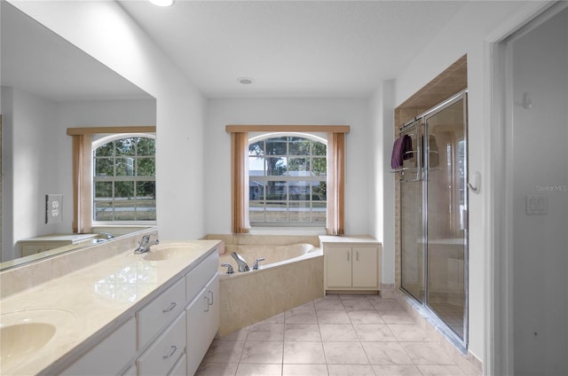 bathroom with vanity, separate shower and tub, and plenty of natural light