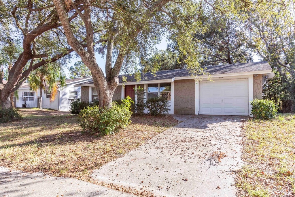 single story home featuring a garage