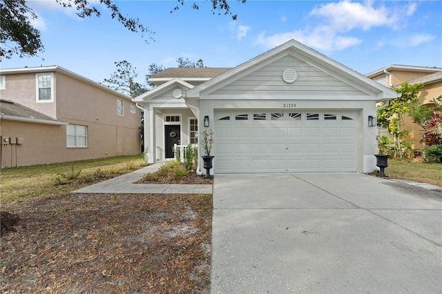 ranch-style home featuring a garage