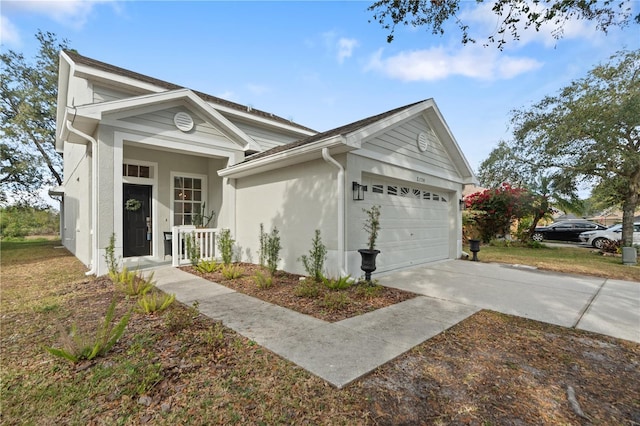 ranch-style home featuring a garage and covered porch