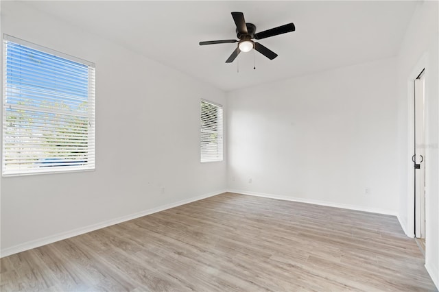 unfurnished room featuring light hardwood / wood-style floors and ceiling fan