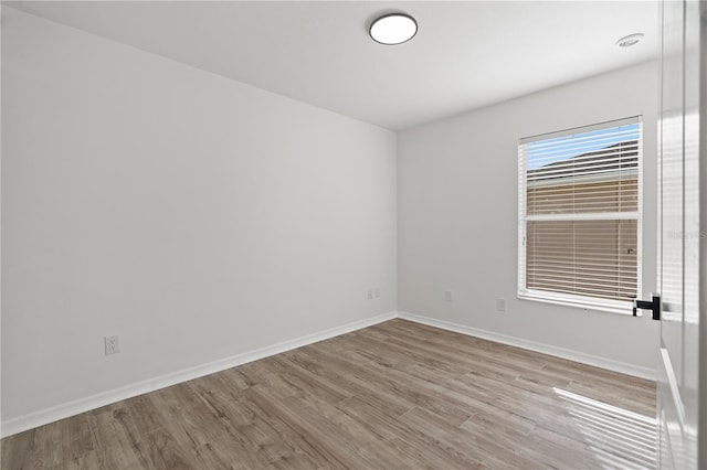 unfurnished room featuring light hardwood / wood-style floors