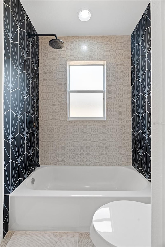 bathroom featuring tile patterned floors and shower / washtub combination