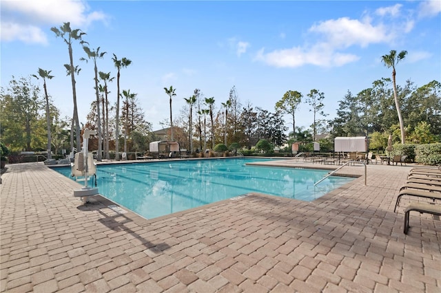 view of swimming pool featuring a patio