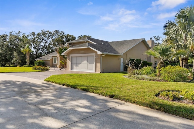 ranch-style home with a garage and a front lawn