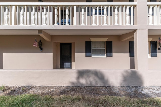 property entrance with a balcony