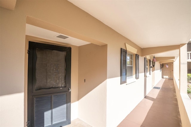 hallway featuring light tile patterned floors