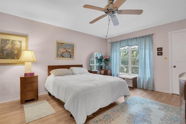 bedroom featuring ceiling fan and light hardwood / wood-style floors