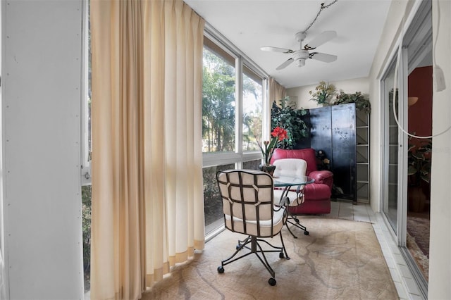 sunroom / solarium with ceiling fan