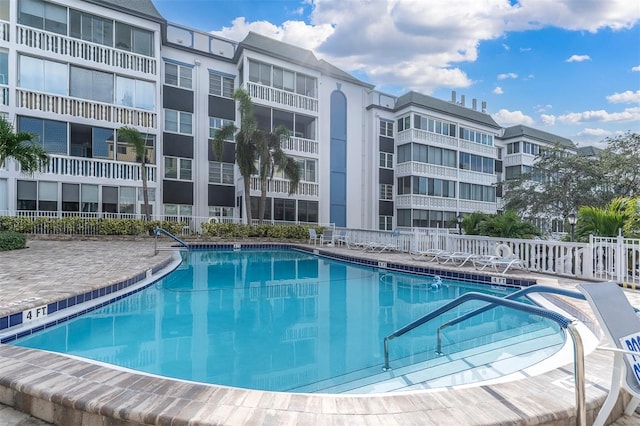 view of swimming pool with a patio