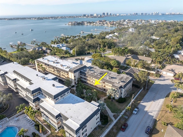 birds eye view of property with a water view