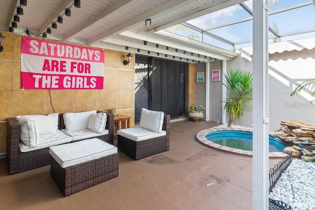 exterior space with glass enclosure and an outdoor hangout area