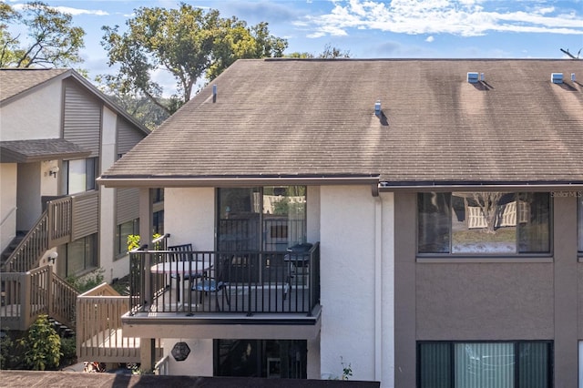 rear view of house with a balcony